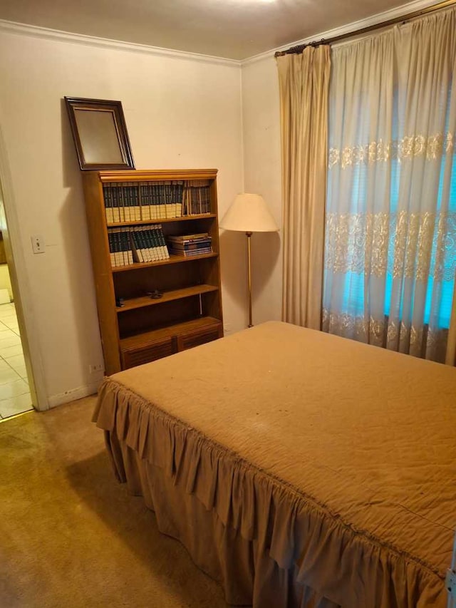 carpeted bedroom featuring ornamental molding