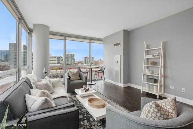 living room featuring hardwood / wood-style floors and a wall of windows