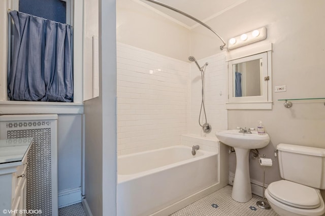 full bathroom with crown molding, sink, tiled shower / bath, tile patterned flooring, and toilet