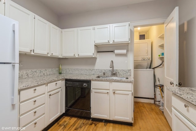 kitchen with dishwasher, white refrigerator, light hardwood / wood-style flooring, and sink