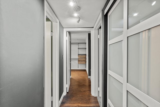 corridor featuring dark wood-type flooring