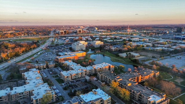 aerial view at dusk with a water view