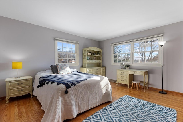 bedroom with hardwood / wood-style floors