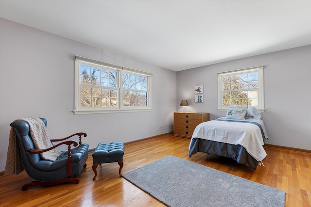 bedroom with light hardwood / wood-style floors