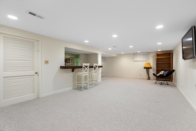 interior space with indoor bar and light carpet