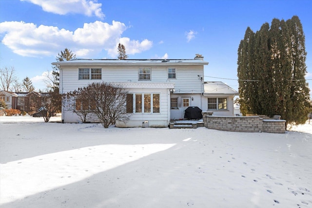 view of snow covered house