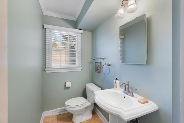 bathroom with ornamental molding, toilet, tile patterned flooring, and sink