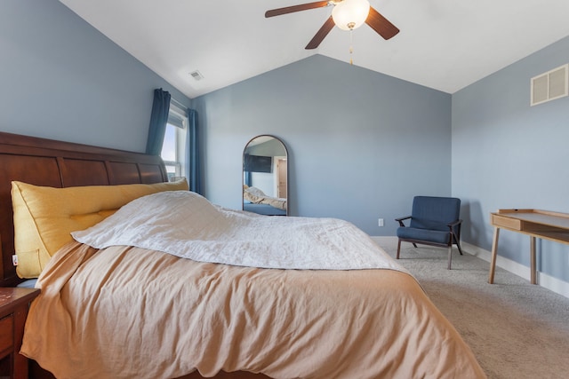 bedroom with ceiling fan, light colored carpet, and vaulted ceiling