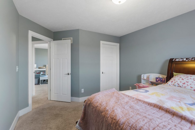 bedroom featuring light colored carpet