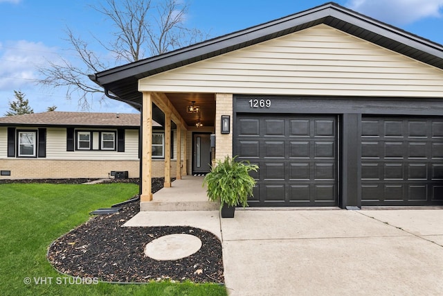 view of front facade with a garage and a front lawn