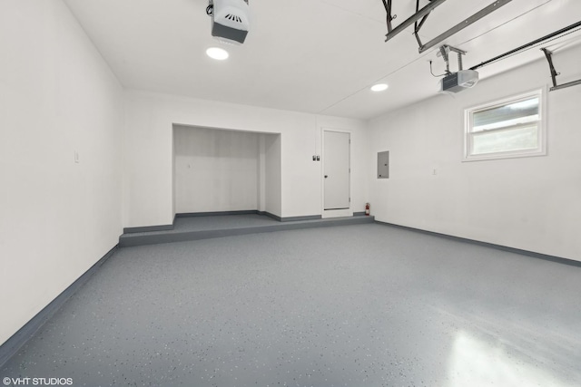 garage featuring a garage door opener and electric panel