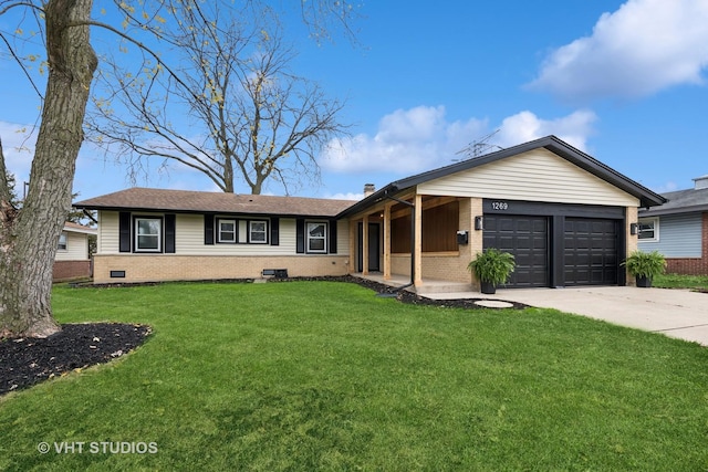 ranch-style home featuring a garage and a front yard