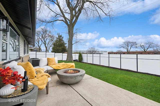 view of patio / terrace with a fire pit and central air condition unit