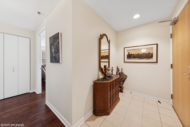 hall with light hardwood / wood-style flooring