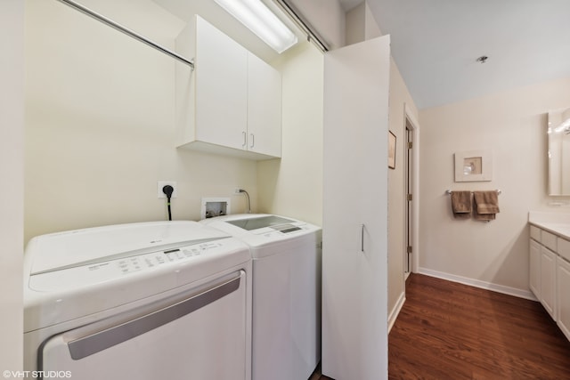 laundry area with dark wood-type flooring and washing machine and dryer