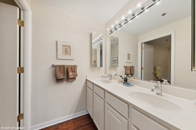 bathroom with vanity and hardwood / wood-style floors