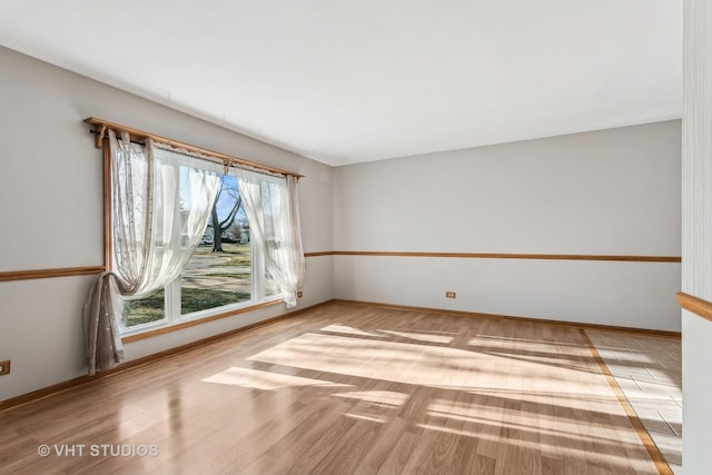 unfurnished room featuring light hardwood / wood-style floors