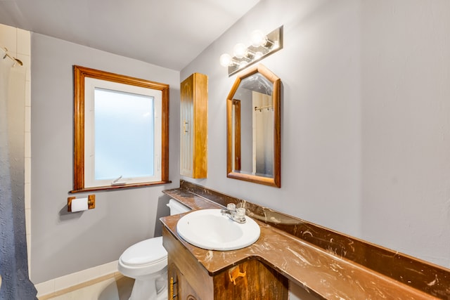 bathroom with vanity, toilet, and a shower with shower curtain