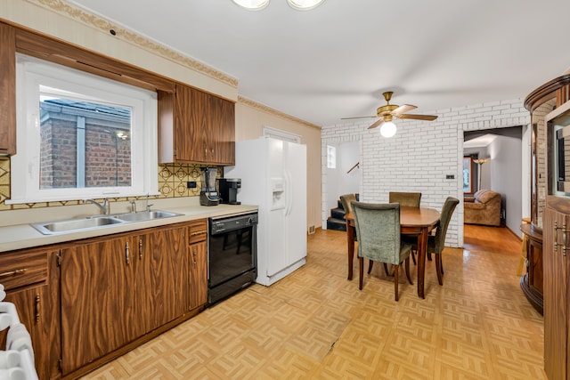 kitchen featuring light parquet floors, black dishwasher, decorative backsplash, sink, and ceiling fan