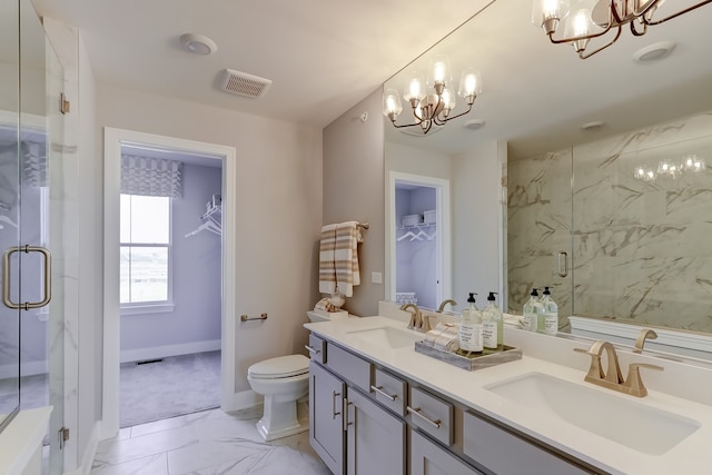 bathroom featuring walk in shower, vanity, a chandelier, and toilet