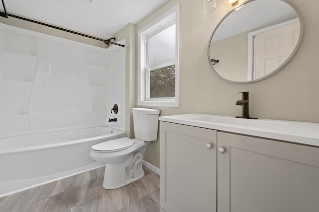 full bathroom featuring toilet, vanity, and shower / washtub combination