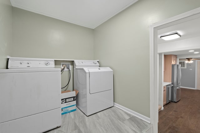 washroom with ceiling fan, separate washer and dryer, light wood-type flooring, and crown molding