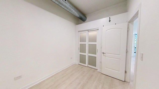 unfurnished room with light hardwood / wood-style flooring