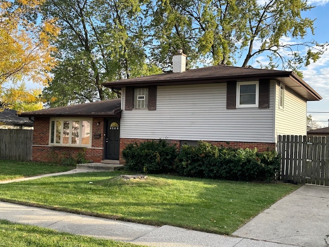 split level home with a front yard