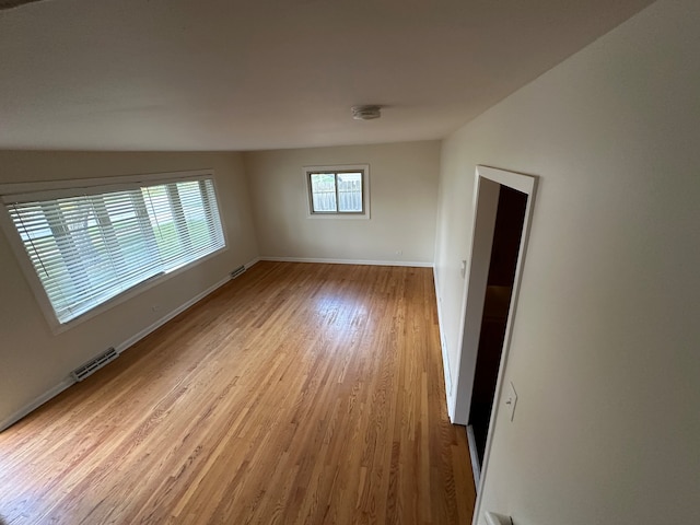 unfurnished room with light hardwood / wood-style flooring