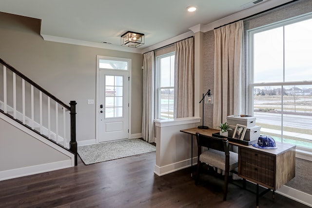 entryway featuring dark wood-type flooring and crown molding