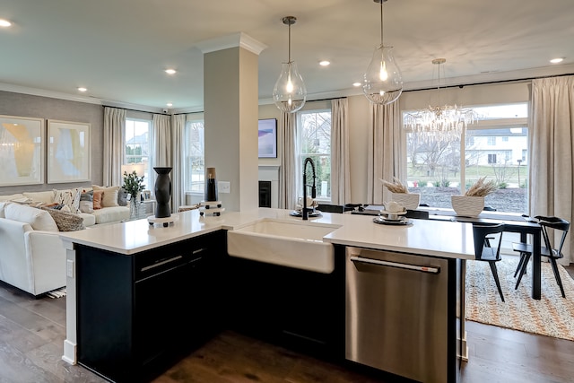 kitchen featuring a healthy amount of sunlight, sink, a kitchen island with sink, and dishwasher