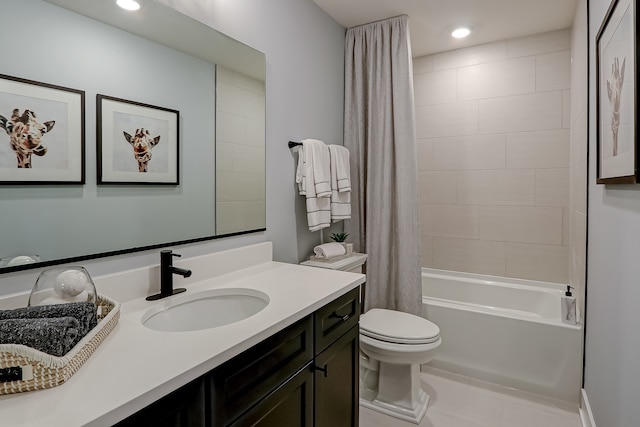 full bathroom with shower / bath combo with shower curtain, tile patterned flooring, vanity, and toilet