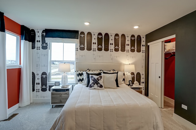 carpeted bedroom featuring a closet