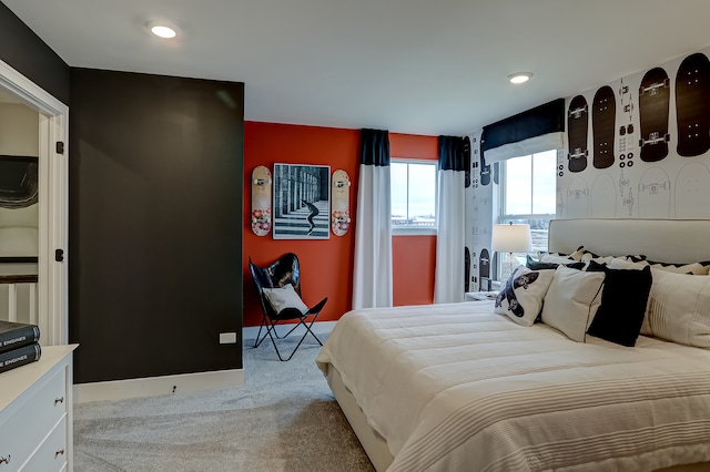 bedroom featuring light carpet