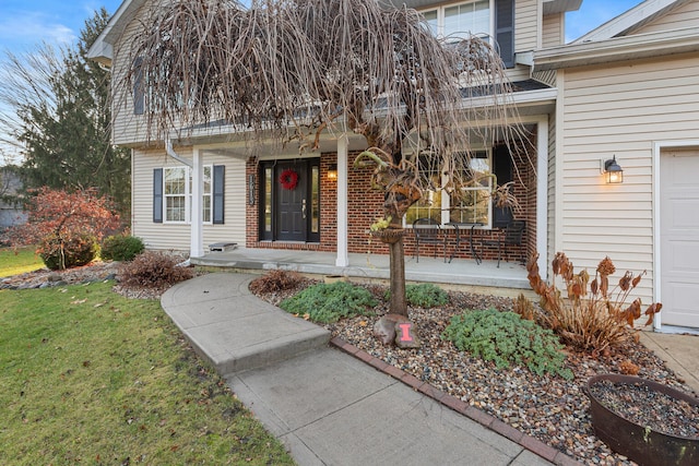 view of exterior entry featuring a garage