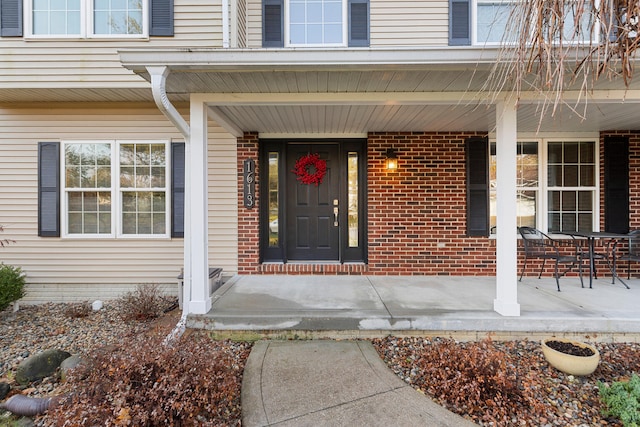 entrance to property featuring a porch