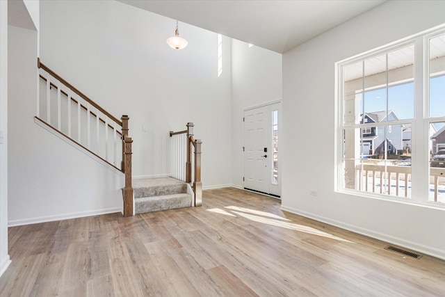 foyer entrance with light wood-type flooring