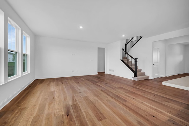 unfurnished living room featuring light wood-type flooring