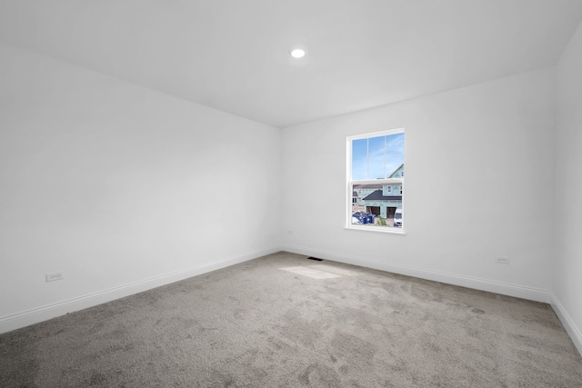 empty room featuring carpet floors