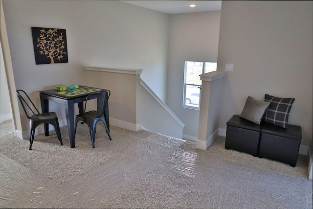 dining room featuring light colored carpet