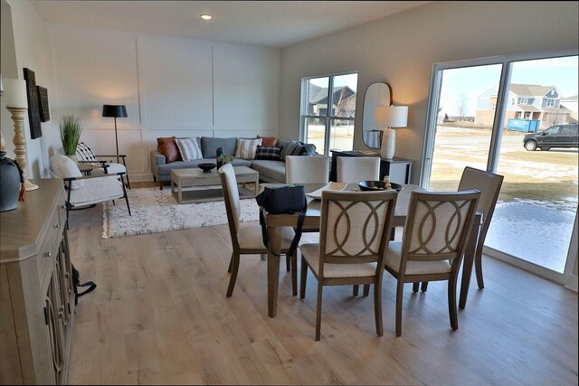 dining area featuring light wood-type flooring