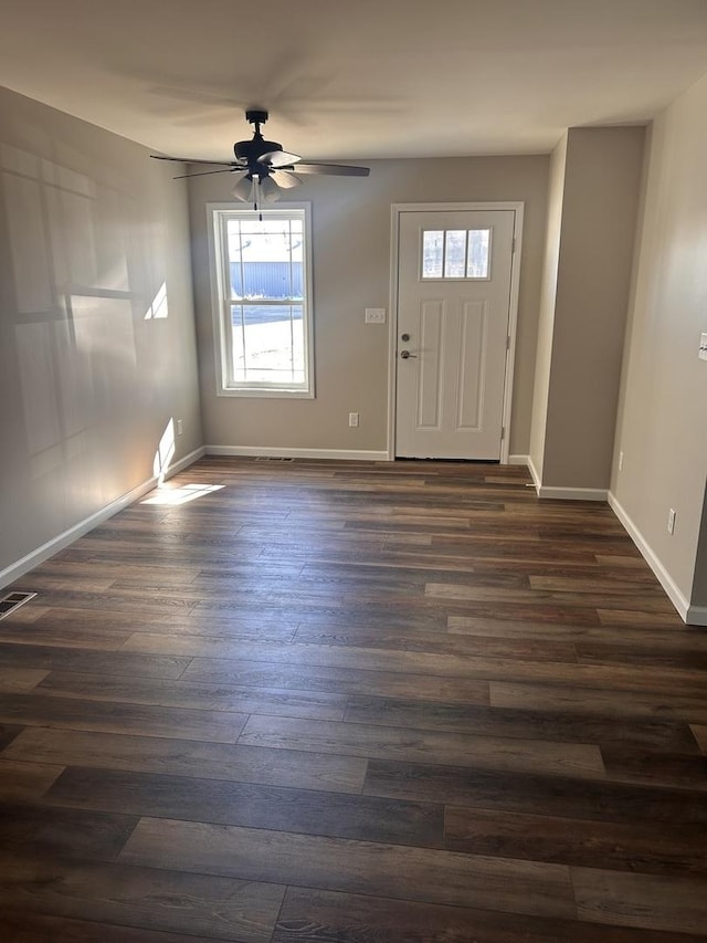 entryway with dark hardwood / wood-style floors and ceiling fan