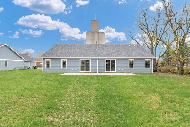 back of house with a yard and a patio area