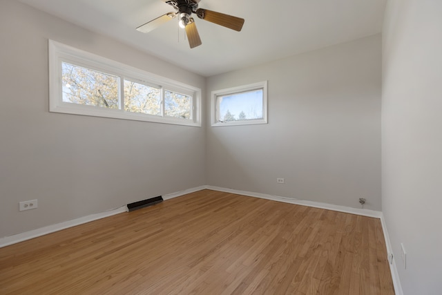 unfurnished room featuring ceiling fan and light hardwood / wood-style flooring