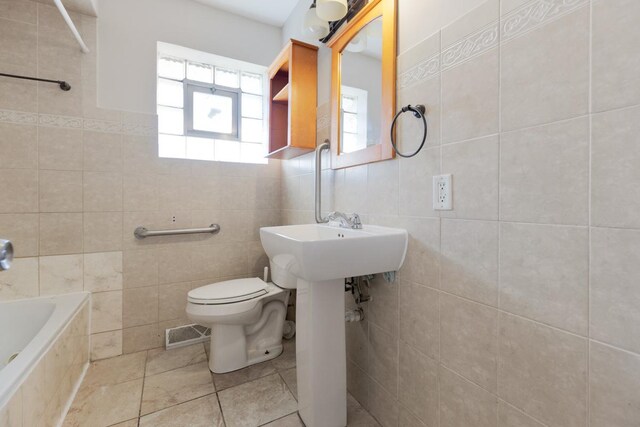 1367 Buffalo Ave, Calumet City, IL 60409 - bathroom with tile walls and toilet