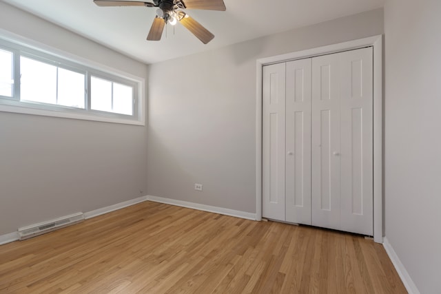 unfurnished bedroom with a closet, ceiling fan, and light hardwood / wood-style flooring