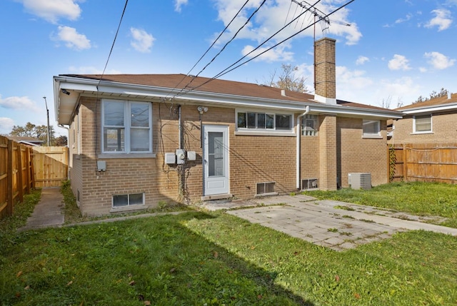 1367 Buffalo Ave, Calumet City, IL 60409 - rear view of property with brick siding, a patio area, a chimney, and central air condition unit
