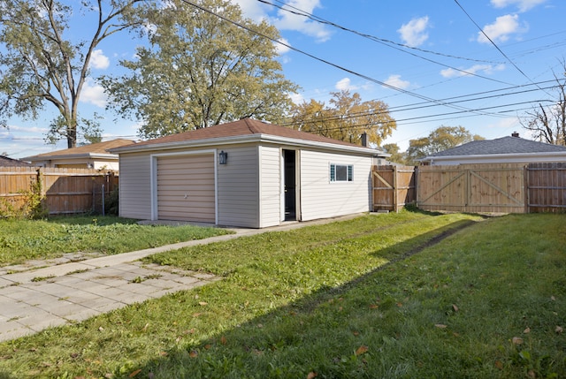 view of outbuilding with a yard