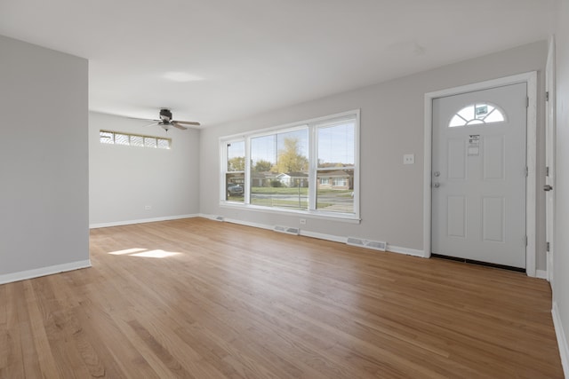 foyer featuring light wood-type flooring and ceiling fan