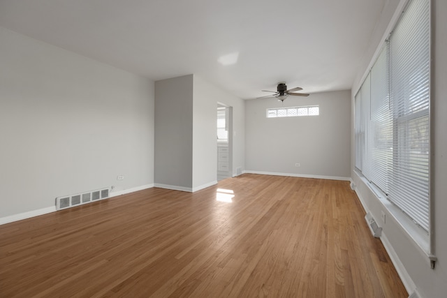 unfurnished room with light hardwood / wood-style flooring and ceiling fan